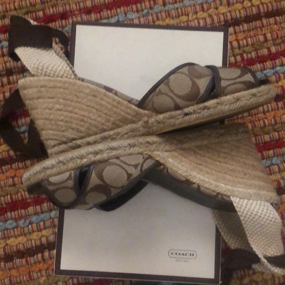 Coach lace up espadrilles. Brown and beige in color.
